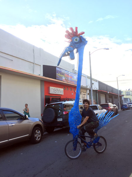Poncili Creación's Efrain del Hierro rides one of the pieces of the exhibition