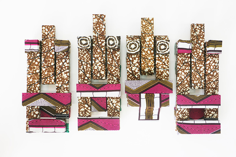 Bambuko, 2016 | Dutch-Wax printed fabric on wood, 15" x 27" x 3"